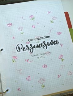 an open notebook with the words comunicion persuasva written in cursive writing