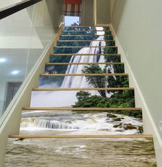 the stairs are painted with waterfalls and trees