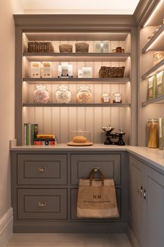 a bag sitting on top of a counter next to shelves filled with books and other items