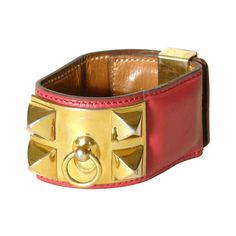 This iconic Hermès Collier de Chien cuff bracelet is made of lipstick red leather with gold plated hardware. This classic design was adapted from a custom designed dog collar made for a private client of Hermès in 1923. Due to the popularity of the design, Hermès began making a belt version of the design for ladies in 1927. It was a number of years later, in 1940, that the company released the design of the Collier de Chien bracelet. please note- I have a matching Collier de Chien belt from the Lipstick Red, Hermes Paris, Leather Cuffs, Dog Design, Dog Collar, Gold Hardware, Cuff Bracelet, Red Leather, Classic Design