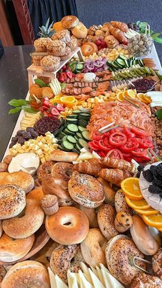 a table filled with lots of different types of donuts and other foods on it