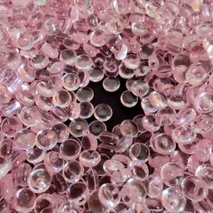 the inside of a pink plastic bubble filled with lots of small round bubbles on top of it