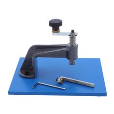 a tool is sitting on top of a blue table