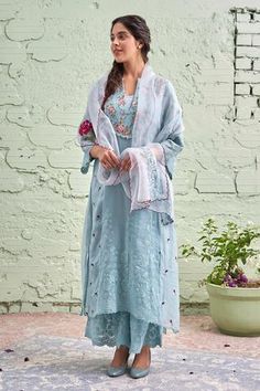 Powder blue kurta with floral print yoke, intricate embroidery, lace trim sleeves and cutwork hem. Comes with palazzo and organza dupatta.
Components:3
Printed, Embroidered
Neckline:Mandarin Collar
Sleeve Length:Three Quarter
Fabric:Cotton, Chanderi, Organza 
Color:Blue
Notched mandarin collar
Lace detailing
Cutwork sleeves and hem
Embroidered palazzo
Embroidered dupatta - Aza Fashions Simple Kurtis, Collar Kurta, Kurta Set For Women, Organza Dupatta, Embroidered Neckline, Indian Fashion Designers, Pernia Pop Up Shop, Fashion Attire, Fashion App