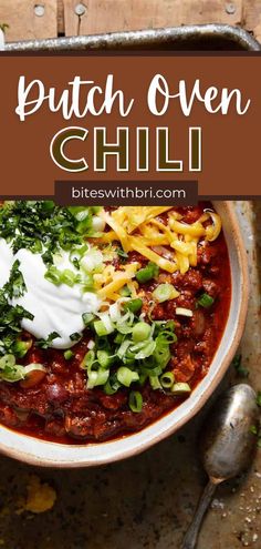 a bowl filled with chili and sour cream