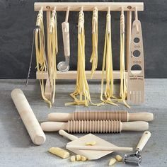 A superb gift for the pasta lover, this set includes all the equipment you need to make fresh pasta at home the traditional Italian way-rolled and cut by hand. All of the tools are made in Italy and include cutters for a variety of pasta shapes, plus easy instructions to guide you through the entire process. Set includes: Cylindrical rolling pin. Collapsible pasta drying rack. Spaghetti cutter rolling pin. Fettuccine cutter rolling pin. Gnocchi and garganelli paddle with pin. Curved roller pasta Pasta Mama, Make Fresh Pasta, Pasta Making Tools, Pasta Drying Rack, Pasta At Home, Pasta Roller, Dinner Wear, Pasta Lover, Pasta Shapes