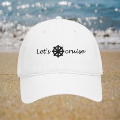 Are you planning a cruise trip? Don't forget to pack a hat! A hat can protect you from the sun, keep you cool, and add some style to your outfit.  100% cotton twill, soft and unstructured 6 panel low-fitting dad hat. One size fit most adult, Garment Washed Pigment Dyed Cotton Twill. Set sail in style with this "Let's Cruise" embroidered white baseball cap, featuring a nautical wheel design! Perfect for cruise enthusiasts and boat lovers, this adjustable distressed hat adds a touch of maritime flair to any outfit. Whether you're on the deck or dreaming of the sea, this cap is a must-have accessory. ⚓🧢 "Let's Cruise" embroidered design with nautical wheel Distressed detailing for a stylish, lived-in look Adjustable strap for a perfect, comfortable fit Ideal for cruise trips, boat lovers, or White Travel Hat For Beach Season, White Hat For Beach Season Travel, White Beach Hat For Travel, White Adjustable Baseball Cap For Travel, Adjustable White Baseball Cap For Travel, White Baseball Cap For Travel, White Travel Cap, White Summer Baseball Cap For Travel, White Baseball Cap For Summer Travel