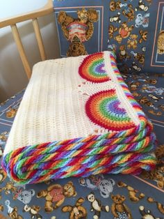 a crocheted blanket on top of a chair