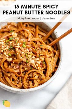 a bowl full of peanut butter noodles with chopsticks in it and the text overlay reads 15 minute spicy peanut butter noodles