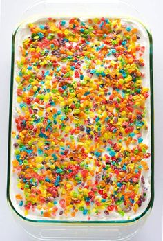 a cake with sprinkles and white frosting