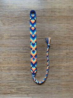 a lanyard that is on top of a wooden table