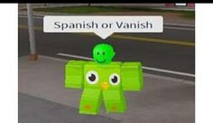 a paper cut out of a green robot with a sign above it that says spanish or danish