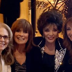 three women are posing for a photo together