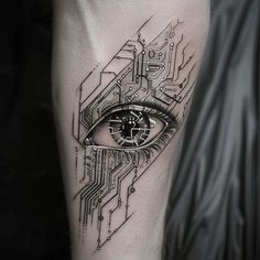 a black and white photo of an eye with circuit board in the shape of a clock