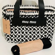 Miu Miu Bag - Shoulder Bag/Handbag - Color: Black And White - Material: Leather - Condition: Excellent Condition/ Never Worn - Size: W10.6*H7.1d5.9 - Accessories: Dust Bag Designer Shopping Bags With Braided Handles, Designer Bags With Braided Handles, Evening White Double Handle Bucket Bag, Black Top Handle Miu Miu Shoulder Bag, Miu Miu Shoulder Bag For Evening, Black Miu Miu Shoulder Bag With Top Handle, Black Miu Miu Top Handle Shoulder Bag, Trendy White Evening Bucket Bag, Miu Miu Double Handle Bag