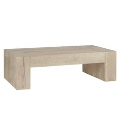 a wooden table sitting on top of a white floor