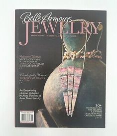 the front cover of a magazine with jewelry on it's back and an image of a