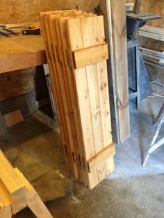 some wooden boards are stacked on top of each other in a room that is being built