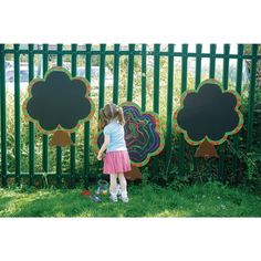 Delightful chalkboard trees edged with plump, red apples to engage children and encourage their creativity. Ideal for indoor and outdoor signs! When using outdoors, simply attach to fencing using the pre-drilled holes and cable ties (supplied). Made from weatherproof Foamex. Simply remove chalk using a damp soft cloth at the end of a days activities ready to be used again.   Product details: H1000cm x W800mm. Pack of 3. Made from plastic. Suitable to be left outdoors.     chalkboard  chalk  tree Chalkboard Tree, Fence Murals, Painted Fences, School Ground, Eco School, Toddler Garden, Outdoor Chalkboard, Preschool Playground, Special Needs Toys