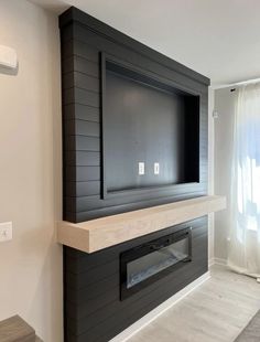 a fireplace with a flat screen tv mounted on it's wall above the mantle