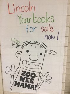 a sign on the wall that reads lincoln yearbooks for sale now zoo wee mama