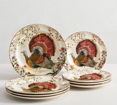 three plates with turkeys on them sitting next to each other in front of a white background