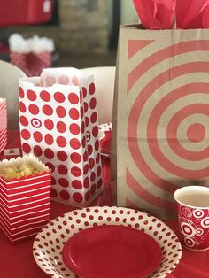 red and white table setting with paper bags