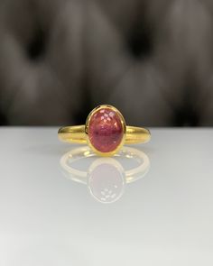 Natural Pink Tourmaline Ring * Dainty Cabachon Ring * Genuine Tourmaline & 14K Solid Gold * Best Gift for Her/Him * Handmade Ring ◎ Details ◎ ○ Gemstone Details .Natural PINK TOURMALINE Oval Cut 9X7 mm approx. 2.09 ct ○ Gold Details 14K Solid Gold Width of Band : 2.50 mm Weight of Ring : approx 3.80 gr Made to Order HANDMADE ITEM ○ Upgrade to Solid 18K Gold, please click the link below: https://www.etsy.com/listing/962826004 For more CABACHON BEZEL rings : http://etsy.me/37fvI60 All of our j Heirloom Gold Tourmaline Ring, Tourmaline Bezel-set Oval Cabochon Ring, Tourmaline Bezel Set Ring In Oval Cabochon, Tourmaline Ring With Bezel Setting In Oval Cabochon, Oval Tourmaline Sapphire Ring For Gifts, Gold Oval Tourmaline Ring, Classic Gold Tourmaline Rings, Gold Tourmaline Rings, Gold Tourmaline Gemstone Rings