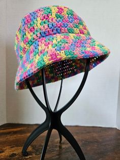 Dive into spring with these cotton bucket hats! These adorable hats will fit most adult heads.  20 cents of any rainbow item sold will be donated to a charity supporting the LQBTQ+ Community. Yarn is 85% recycled cotton and 15% polyester Washing Instructions: Machine wash warm. Tumble dry low heat. Do not iron. Wash color separately, some colors may run. Due to the handmade nature of our products, there may be slight variations in color and/or craftsmanship. I strive to provide the best quality, all products are made at my in home craft area. Product may have some slight imperfections as all available items are 100% handmade. Colors my vary slightly from image shown based on lighting and screen settings. Colorful Spring Bucket Hat, Fun Cotton Beanie Hat, Colorful Bucket Hat For Spring, Colorful Casual Bucket Sun Hat, Casual Colorful Bucket Sun Hat, Colorful Casual Bucket Hat, Casual Multicolor Cotton Bucket Hat, Colorful Adjustable Bucket Hat, Fun Multicolor Bucket Hat For Spring