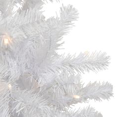 a white christmas tree with lights on it