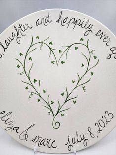 a white plate with a heart on it that says happy new year and happily married