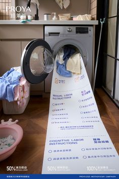 a washing machine with clothes in it next to a dryer and other items on the floor