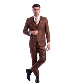 Indulge in the warm tones of the Apollo Collection Cognac Sharkskin Three-Piece Suit. This suit's luxurious shade and hybrid fit merge to create an exceptionally stylish and comfortable ensemble, suitable for any elegant occasion.   Key Features:     Material:  Premium sharkskin for a subtle texture and sheen.   Jacket Style:  Single breasted with a two-button closure.   Lapel:  Notch lapel for a classic and versatile look.   Pockets:  Two flap pockets on the jacket.   Vest:  Sharkskin, five-button, V-neck design.   Pants Fit:  Hybrid fit for a comfortable yet flattering silhouette.   Pants Style:  Flat front for a smooth, contemporary appearance.   Pants Pockets:  Two back besom pockets and two angled front slip pockets.     Sizing Advice:  When choosing a hybrid fit suit, measure your ch Brown Groomsmen Suits, Brown Wedding Suit, Brown Groomsmen, Brown Tuxedo, Sharkskin Suit, Modern Fit Suit, Dapper Suits, Cheap Suits, Brown Wedding