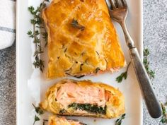 a white plate topped with salmon and puff pastry