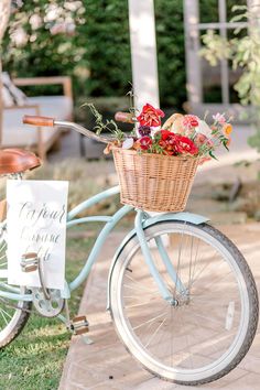 a bicycle with a basket full of flowers