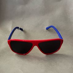 Red And Blue Retro Sunglasses. Arrows On Each Arm. New With Tags. Red Plastic Sunglasses For Summer, Red Wayfarer Sunglasses For Summer, Trendy Red Wayfarer Sunglasses, Fun Red Plastic Sunglasses, Fun Red Sunglasses, Casual Blue Plastic Sunglasses, Modern Red Plastic Sunglasses, Retro Red Sunglasses With Uva Protection, Fun Red Sunglasses With Gradient Lenses