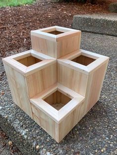 four wooden boxes sitting on the ground