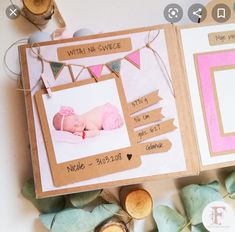 a baby's first year album is displayed on a table with leaves and other items