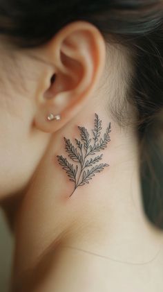 A minimalist black outline of a delicate fern tattoo on the side of a female neck, subtly placed just below the ear, featuring realistic details and no inscriptions, perfect for Pinterest inspiration.