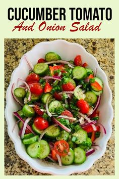 cucumber tomato and onion salad in a white bowl with the title above it