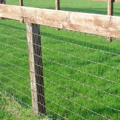 the fence is made of wood and wire