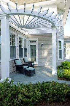 an image of a patio with chairs and pergolan on the front porch, as seen on pinterest