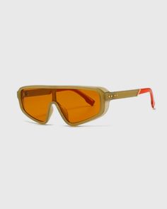 Shield-style lens with two-tone colored sunglasses temple are the prominent features of this model. The clean, stylish frame has a near-wraparound design with a pseudo-aviator, 80s retro look.  Size: 145 mm 70 mm 48 mm 20 mm 132 mm Specs: ShieldAthleisure PC Polycar-bonate Anti- Reflective UV400 protection Groovy Glasses, Corset Blouse, Retro Accessories, Cool Sunglasses, Sustainable Jewelry, 80s Retro, Brown Silver