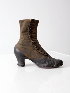 This is a pair of late Victorian era boots. Beautifully aged, two tone leather shapes the button up boots. They feature wood stacked heels.late 1800s to early 1900s.  • two tone leather shoes• button up boots• wood stacked heelsCONDITIONIn good condition with wear consistent with age and use.  A button is missing on one of the boots. The soles have worn holes and the leather has some cracking on the boots.MEASUREMENTSOutSole Length:  10.25" ... 26 cmWidth:  2.875" ... 7.3 cmHeel Height:  2.5" .. Leather Cap Toe Boots With Buttons, Victorian Boots With Leather Sole, Victorian Style Round Toe Boots For Fall, Victorian Round Toe Boots For Fall, Victorian Boots With Leather Sole For Fall, Vintage Heeled Boots With Leather Sole For Fall, Victorian Boots With Leather Sole And Round Toe, Victorian Leather Boots With Round Toe, Fitted Vintage Cap Toe Boots