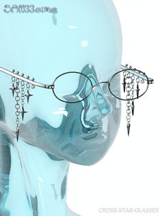 a mannequin head wearing glasses with spikes and chains hanging from it's sides