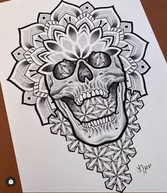 a drawing of a skull with flowers on it