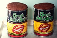 two cans of food sitting on top of a counter