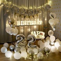 a birthday party with balloons and streamers in the shape of number twenty twos