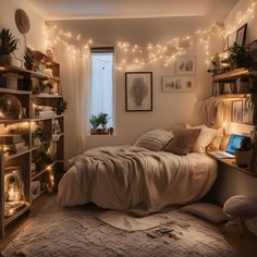 a bedroom with lights strung from the ceiling and a bed in front of a window