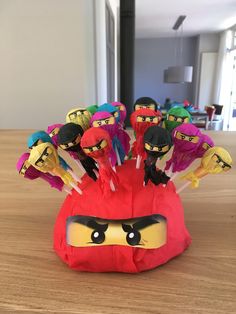 a bunch of angry birds sitting on top of a wooden table